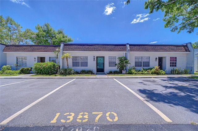 13870 Oakwood Ln Unit 13870, Seminole, FL 33776 - view of building exterior with uncovered parking