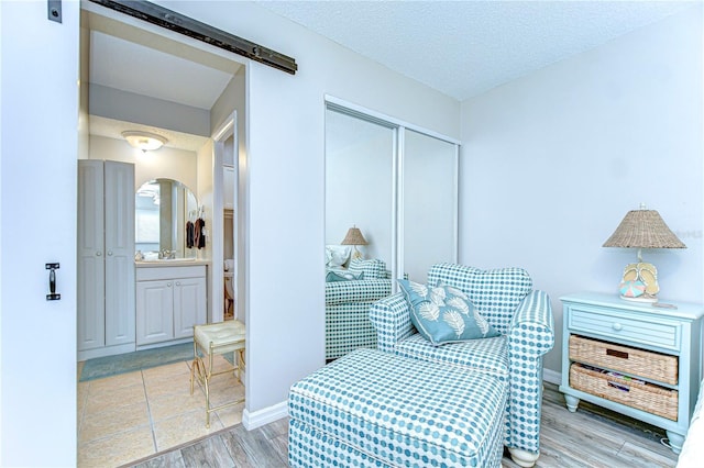 13870 Oakwood Ln Unit 13870, Seminole, FL 33776 - living area with baseboards, wood finished floors, and a textured ceiling