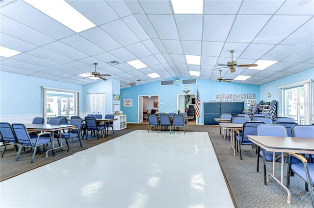 13870 Oakwood Ln Unit 13870, Seminole, FL 33776 - carpeted dining room with vaulted ceiling, a ceiling fan, visible vents, and a paneled ceiling