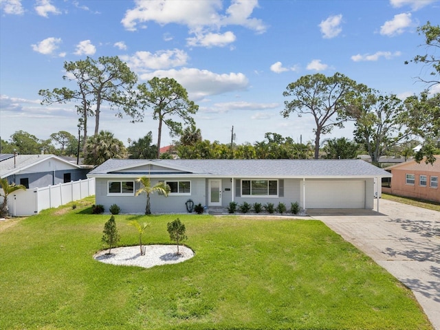 single story home with fence, a shingled roof, concrete driveway, a front yard, and a garage