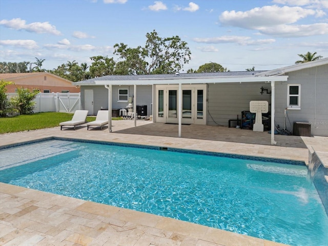 view of pool with a gate, a patio area, a fenced in pool, and fence
