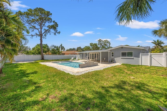 view of pool with a fenced backyard, a patio, a fenced in pool, and french doors