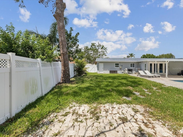 view of yard with a patio and a fenced backyard