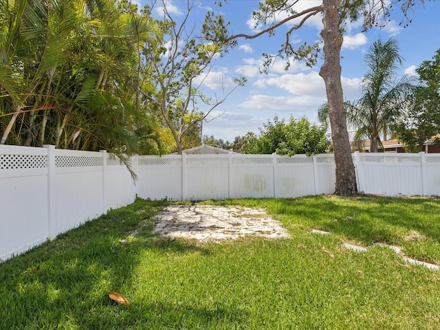 view of yard with a fenced backyard