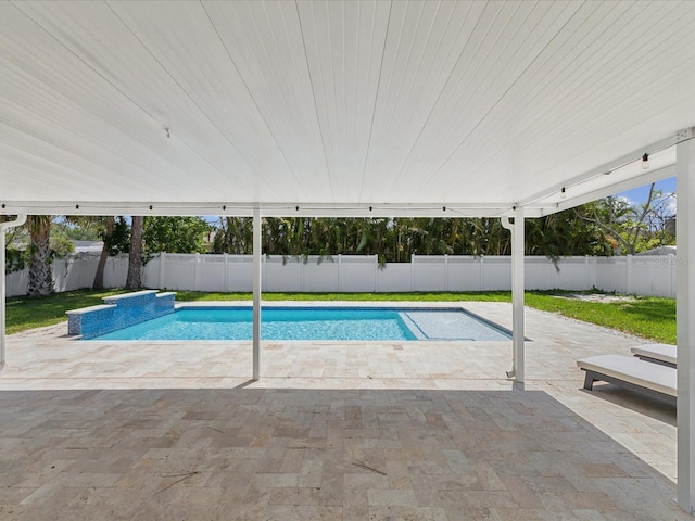 view of swimming pool with a fenced backyard, a fenced in pool, and a patio