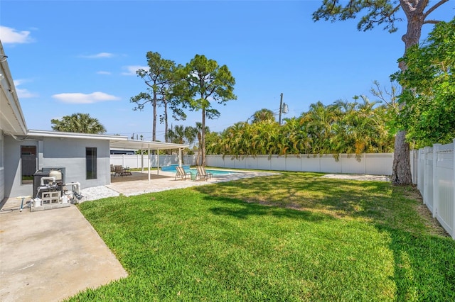 view of yard with a patio area, a fenced backyard, and a fenced in pool