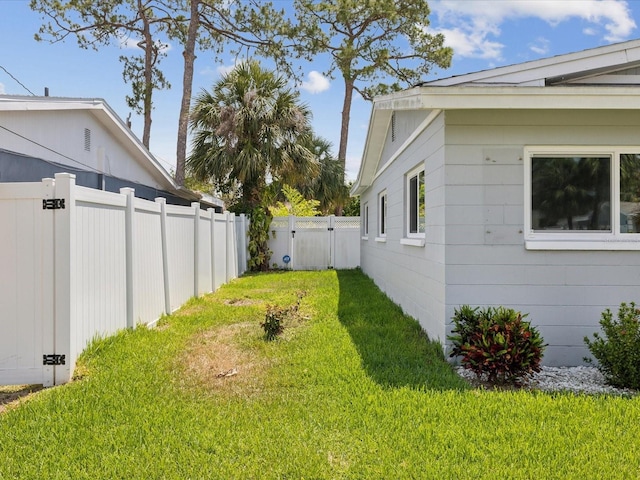 view of yard featuring a gate and fence