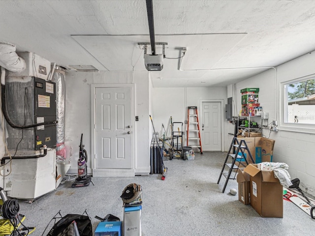 garage with electric panel, a garage door opener, and heating unit