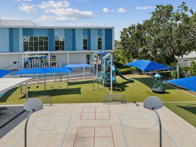 community play area featuring a lawn