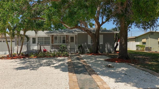 6609 Dartmouth Ave N, Saint Petersburg, FL 33710 - view of front of home featuring fence, a porch, and cooling unit