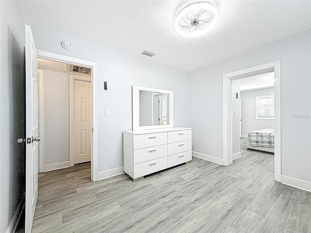6609 Dartmouth Ave N, Saint Petersburg, FL 33710 - bedroom featuring baseboards, light wood-style floors, and visible vents