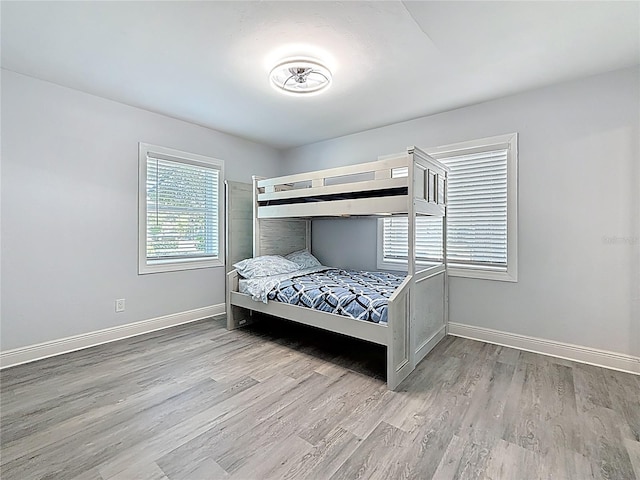 6609 Dartmouth Ave N, Saint Petersburg, FL 33710 - bedroom with baseboards and wood finished floors