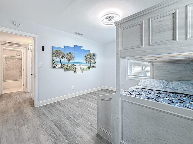 6609 Dartmouth Ave N, Saint Petersburg, FL 33710 - kitchen featuring baseboards, visible vents, and light wood-type flooring