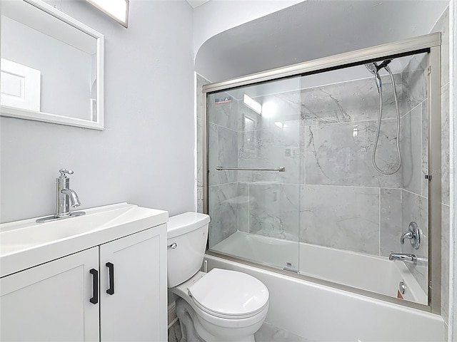 6609 Dartmouth Ave N, Saint Petersburg, FL 33710 - bathroom with bath / shower combo with glass door, toilet, and vanity