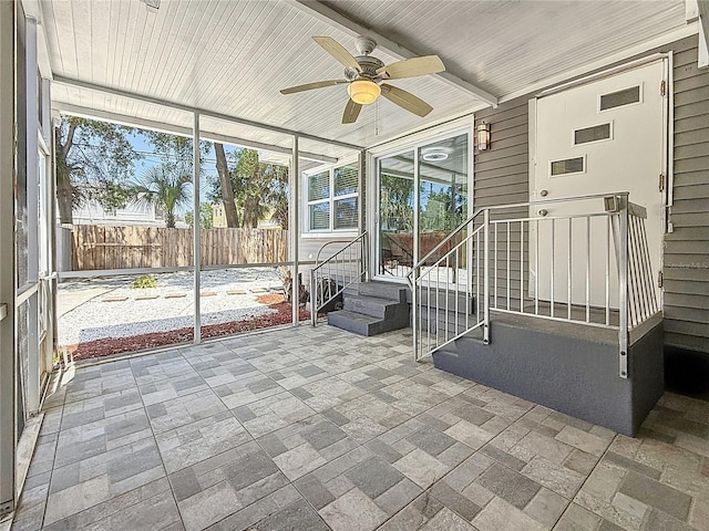 6609 Dartmouth Ave N, Saint Petersburg, FL 33710 - unfurnished sunroom featuring plenty of natural light, entry steps, and ceiling fan