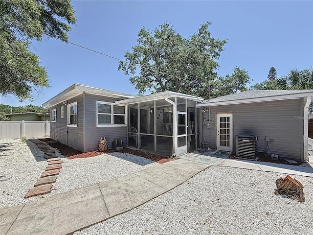 6609 Dartmouth Ave N, Saint Petersburg, FL 33710 - rear view of house featuring a sunroom and fence