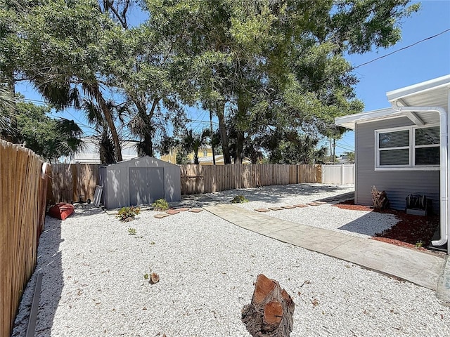6609 Dartmouth Ave N, Saint Petersburg, FL 33710 - view of yard featuring a fenced backyard, a patio, and a shed