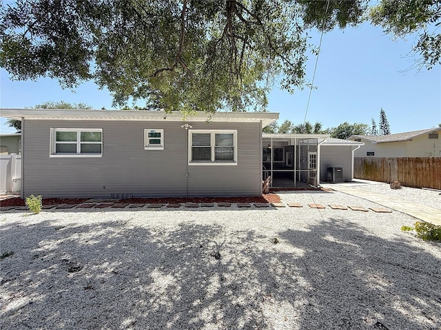 6609 Dartmouth Ave N, Saint Petersburg, FL 33710 - rear view of property featuring a sunroom and fence