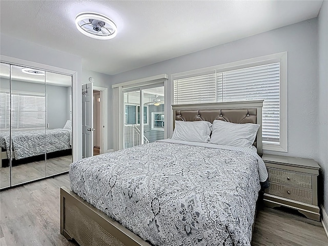 6609 Dartmouth Ave N, Saint Petersburg, FL 33710 - bedroom featuring wood finished floors, a closet, and baseboards