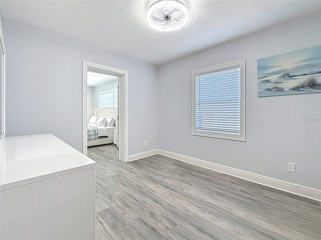 6609 Dartmouth Ave N, Saint Petersburg, FL 33710 - interior space featuring baseboards and light wood-style floors