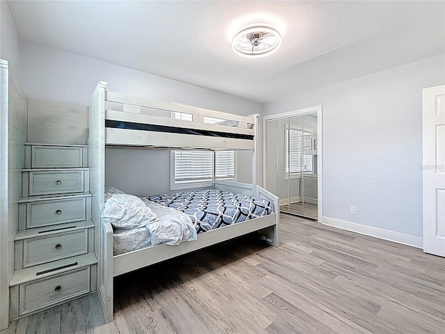 6609 Dartmouth Ave N, Saint Petersburg, FL 33710 - bedroom with baseboards, wood finished floors, and a closet