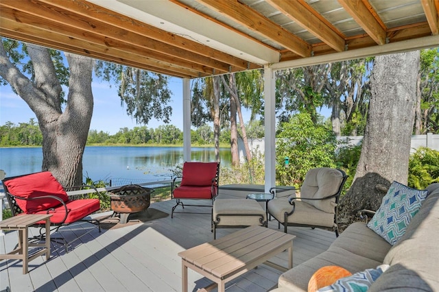19254 Blount Rd, Lutz, FL 33558 - wooden terrace with an outdoor fire pit and a water view