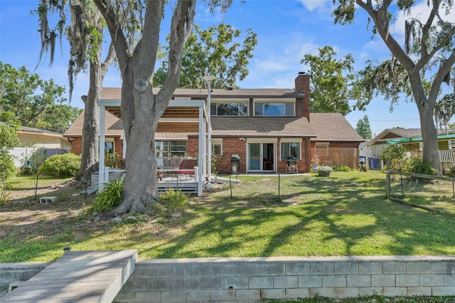 19254 Blount Rd, Lutz, FL 33558 - rear view of property with brick siding and a chimney