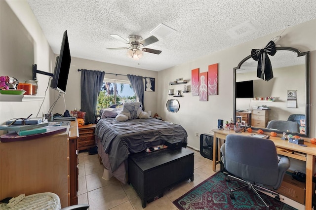 19254 Blount Rd, Lutz, FL 33558 - bedroom with an office area, light tile patterned flooring, a textured ceiling, and a ceiling fan