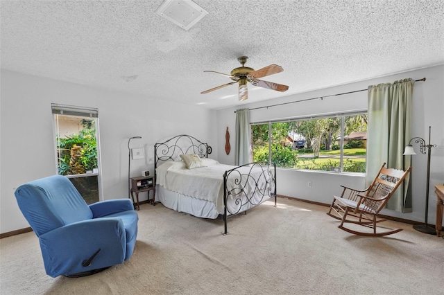 19254 Blount Rd, Lutz, FL 33558 - bedroom featuring carpet floors, a textured ceiling, baseboards, and a ceiling fan