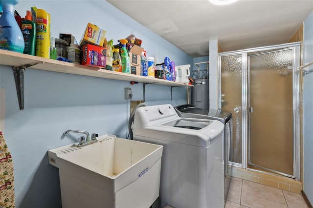 19254 Blount Rd, Lutz, FL 33558 - laundry room with washing machine and clothes dryer, a sink, water heater, and light tile patterned flooring
