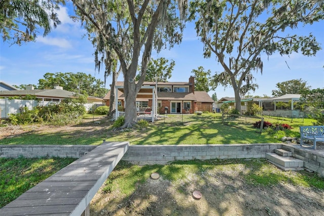 19254 Blount Rd, Lutz, FL 33558 - back of property featuring a chimney and brick siding