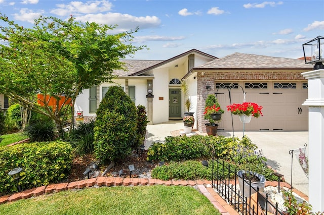 1511 Woonsocket Ln, Brandon, FL 33511 - view of front of house featuring a garage, roof with shingles, and driveway