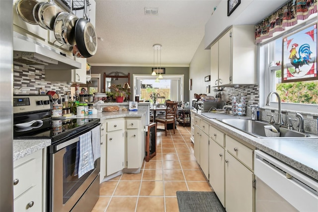 1511 Woonsocket Ln, Brandon, FL 33511 - kitchen featuring stainless steel electric range oven, white dishwasher, a sink, light countertops, and tasteful backsplash
