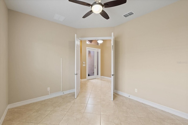 16055 Golden Lakes Dr, Wimauma, FL 33598 - unfurnished room with visible vents, baseboards, ceiling fan, and light tile patterned floors