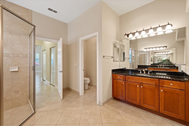 16055 Golden Lakes Dr, Wimauma, FL 33598 - full bathroom with a shower stall, toilet, tile patterned floors, and visible vents