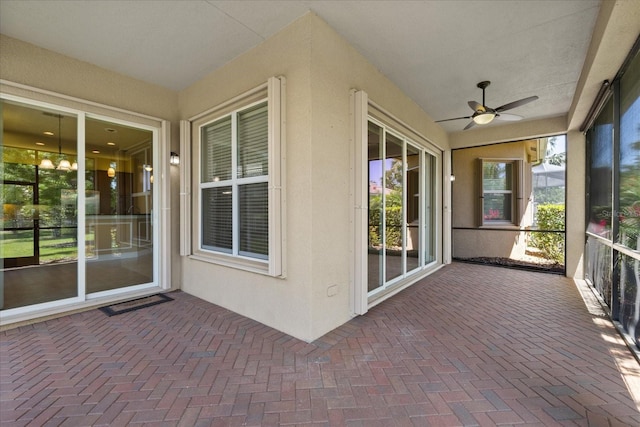 16055 Golden Lakes Dr, Wimauma, FL 33598 - unfurnished sunroom featuring a ceiling fan