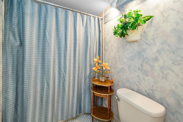 19925 Gulf Blvd Unit 503, Indian Shores, FL 33785 - bathroom featuring toilet, a shower with shower curtain, and tile patterned flooring