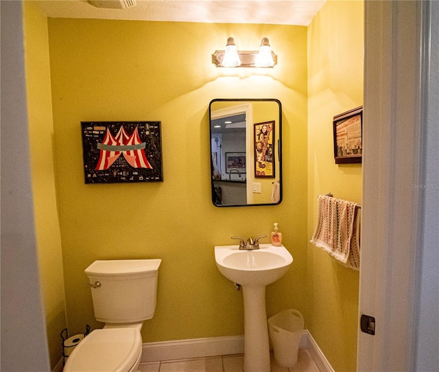 750 4th Ave S Unit 403C, Saint Petersburg, FL 33701 - half bathroom with tile patterned floors and toilet