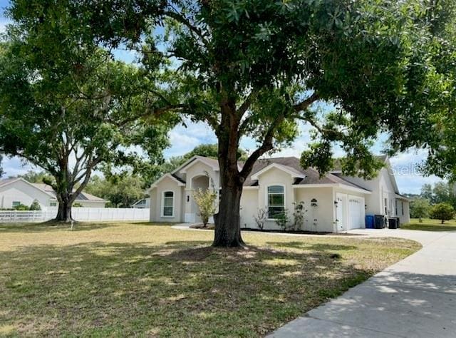17127 Brown Rd, Odessa, FL 33556 - ranch-style house featuring a garage and driveway
