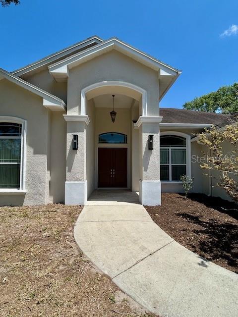 17127 Brown Rd, Odessa, FL 33556 - property entrance with stucco siding