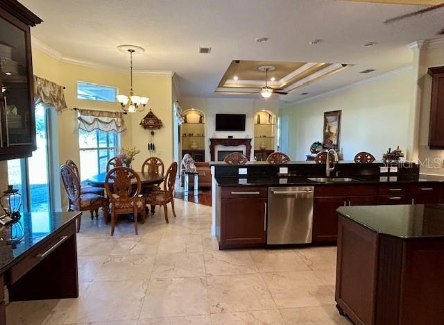 17127 Brown Rd, Odessa, FL 33556 - kitchen featuring dishwasher, a sink, ornamental molding, a fireplace, and open floor plan