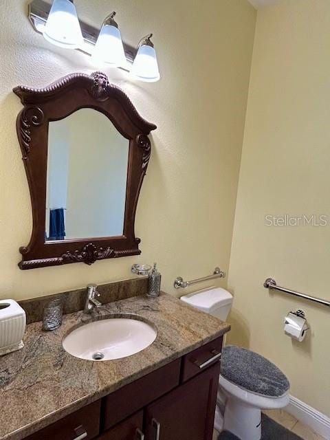 17127 Brown Rd, Odessa, FL 33556 - half bath with vanity, toilet, and tile patterned floors