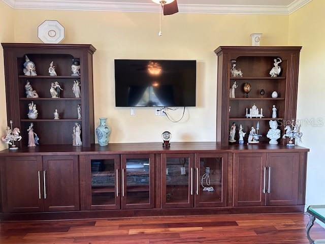 17127 Brown Rd, Odessa, FL 33556 - bar with ornamental molding and dark wood-style flooring