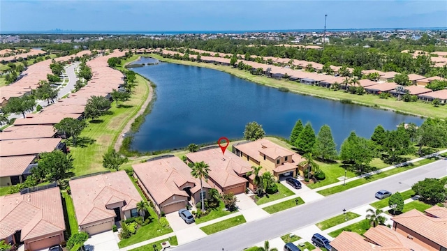birds eye view of property with a water view and a residential view
