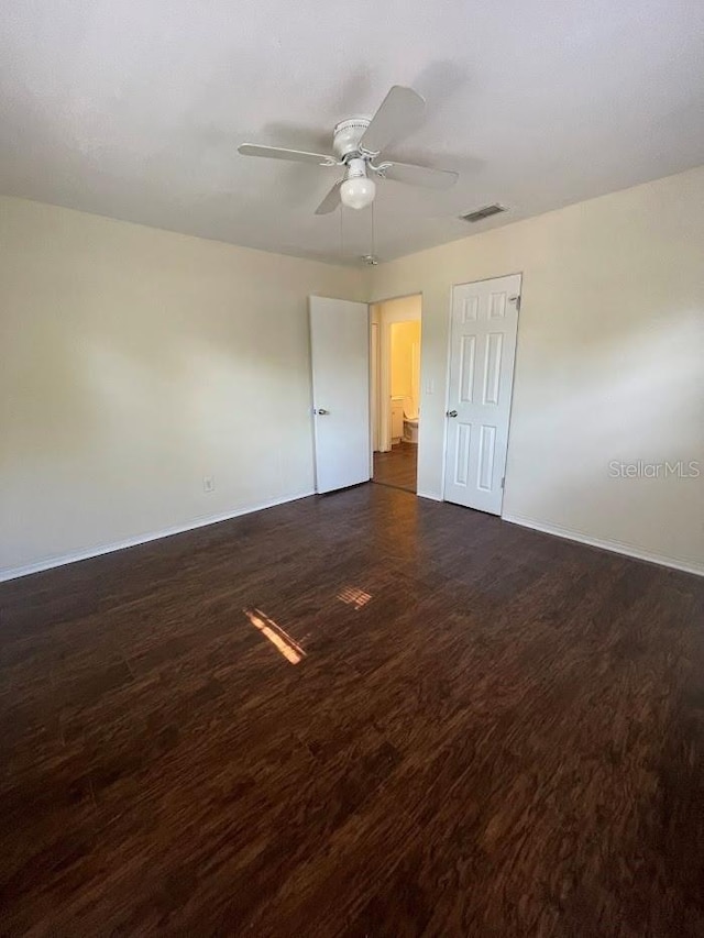 321 David Ave, Clearwater, FL 33759 - unfurnished room featuring dark wood finished floors, ceiling fan, baseboards, and visible vents