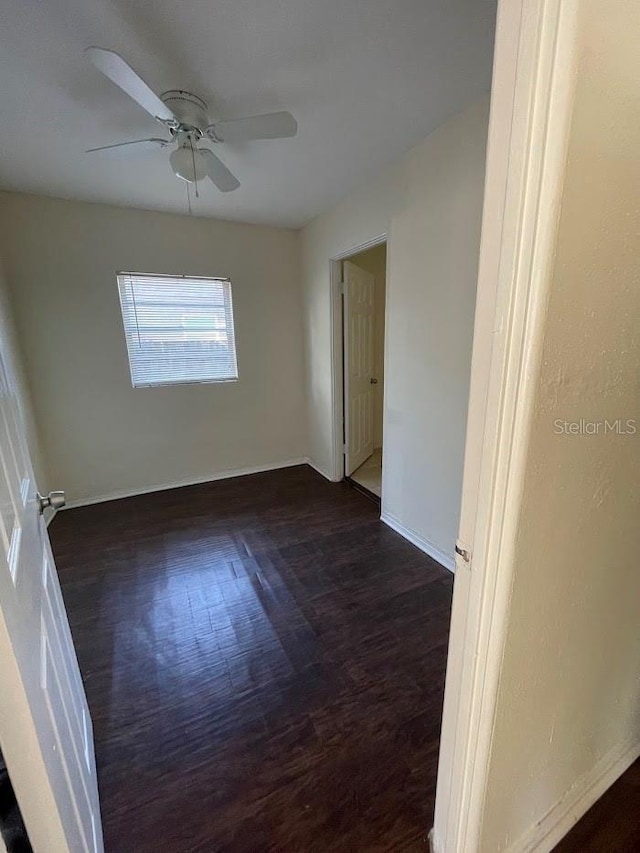 321 David Ave, Clearwater, FL 33759 - unfurnished room with baseboards, ceiling fan, and dark wood finished floors