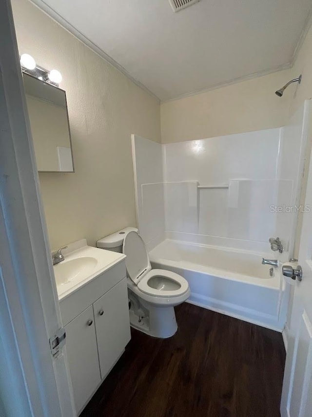 321 David Ave, Clearwater, FL 33759 - bathroom with tub / shower combination, wood finished floors, toilet, and vanity