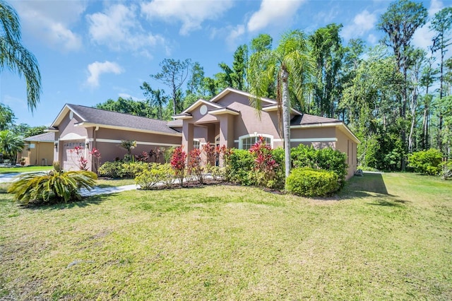 1135 Wyndham Lakes Dr, Odessa, FL 33556 - view of front of house featuring an attached garage, a front lawn, and stucco siding