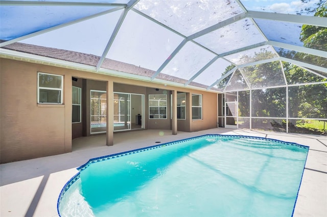 1135 Wyndham Lakes Dr, Odessa, FL 33556 - outdoor pool featuring glass enclosure and a patio