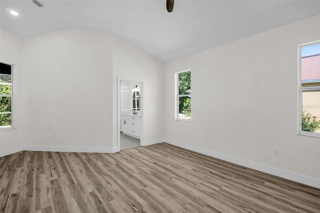 1135 Wyndham Lakes Dr, Odessa, FL 33556 - interior space with vaulted ceiling, wood finished floors, and a wealth of natural light
